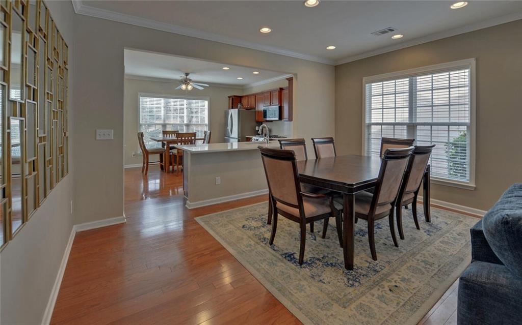 6213 Azalea Way Hoschton, GA 30548 - Photo 11 of 56 a view of a dining room with furniture