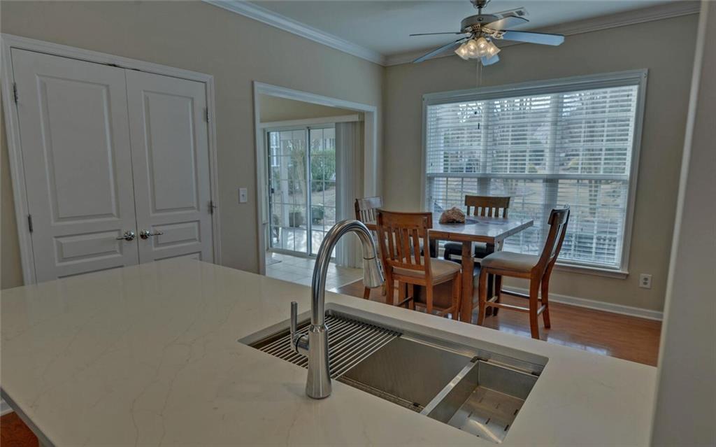 6213 Azalea Way Hoschton, GA 30548 - Photo 12 of 56 a view of a dining room with furniture window and outside view