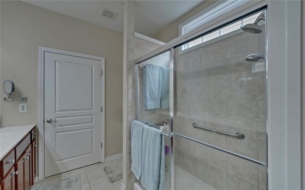 6213 Azalea Way Hoschton, GA 30548 - Photo 23 of 56 a bathroom with a shower