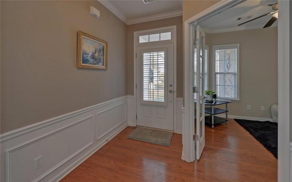 6213 Azalea Way Hoschton, GA 30548 - Photo 3 of 56 a view of livingroom with hardwood floor and hallway