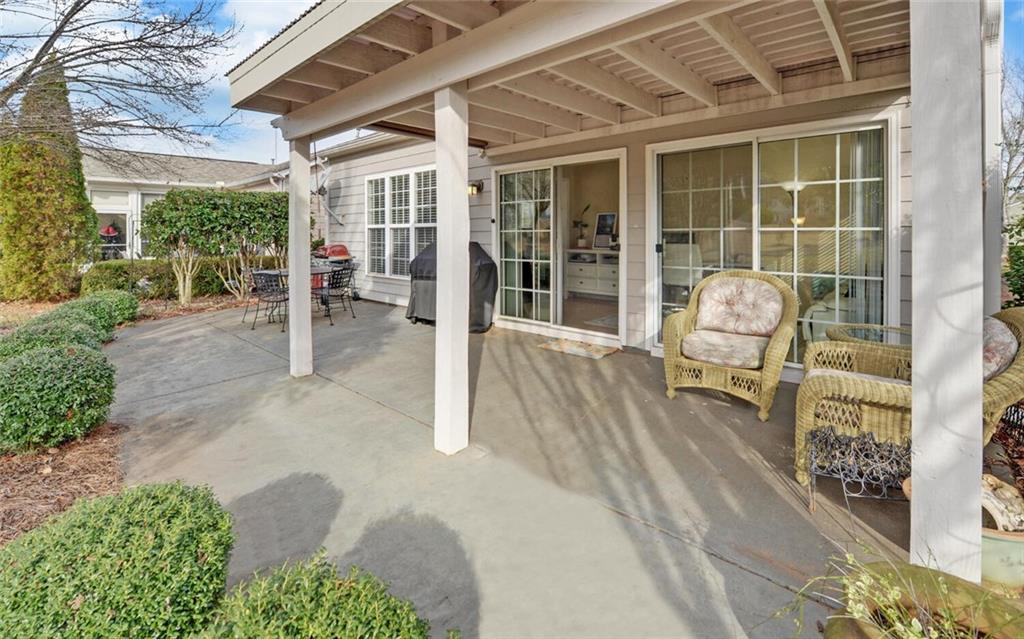 6213 Azalea Way Hoschton, GA 30548 - Photo 37 of 56 view of a patio with table and chairs and potted plants