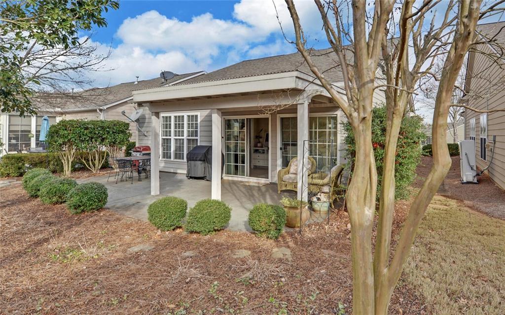 6213 Azalea Way Hoschton, GA 30548 - Photo 39 of 56 a front view of a house with garden