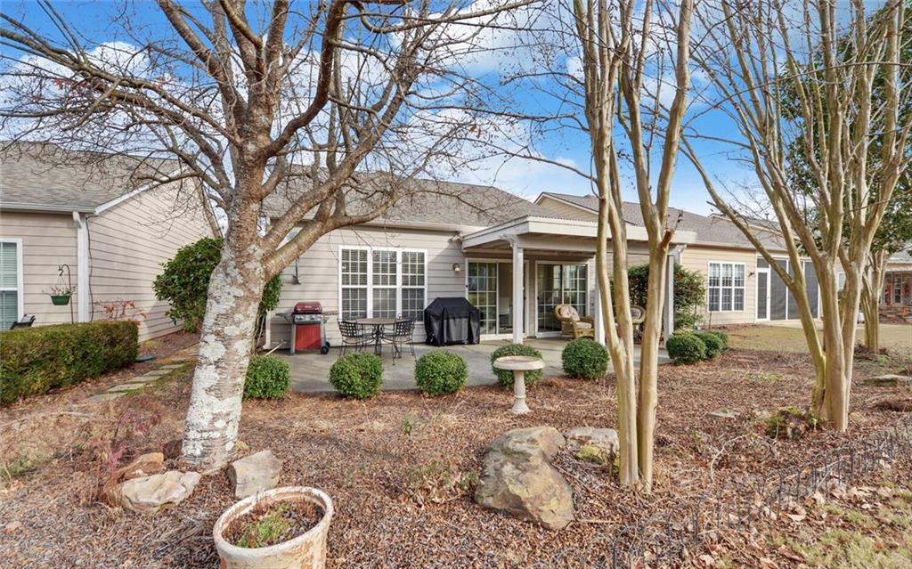 6213 Azalea Way Hoschton, GA 30548 - Photo 40 of 56 a front view of a house with garden