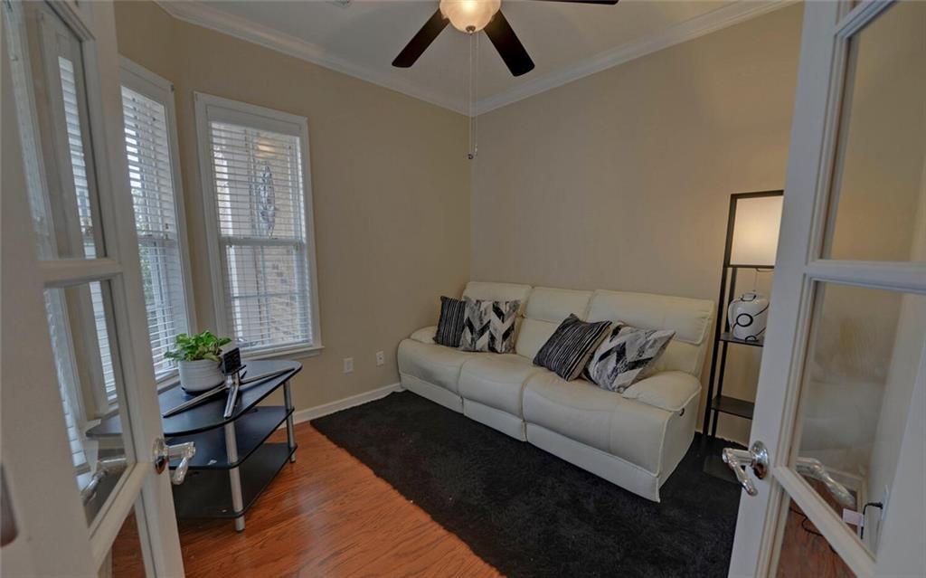 6213 Azalea Way Hoschton, GA 30548 - Photo 4 of 56 a living room with furniture and a flat screen tv