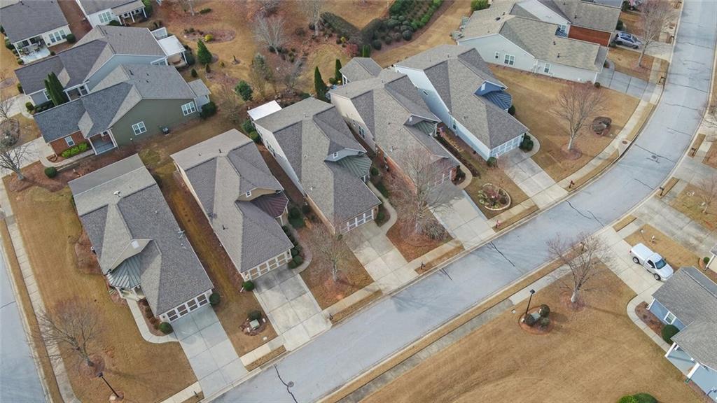6213 Azalea Way Hoschton, GA 30548 - Photo 48 of 56 an aerial view of a residential apartment building with a yard