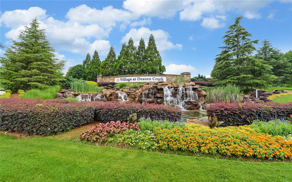 6213 Azalea Way Hoschton, GA 30548 - Photo 50 of 56 a view of a garden with a building in the background