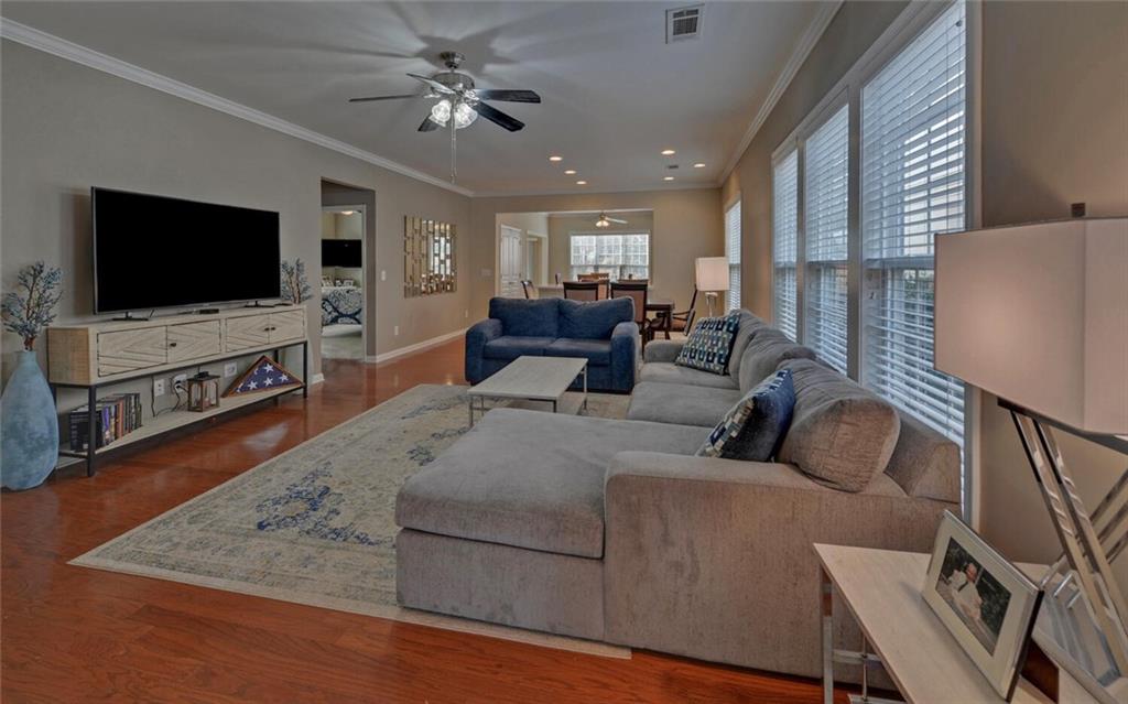 6213 Azalea Way Hoschton, GA 30548 - Photo 5 of 56 a living room with furniture and a flat screen tv