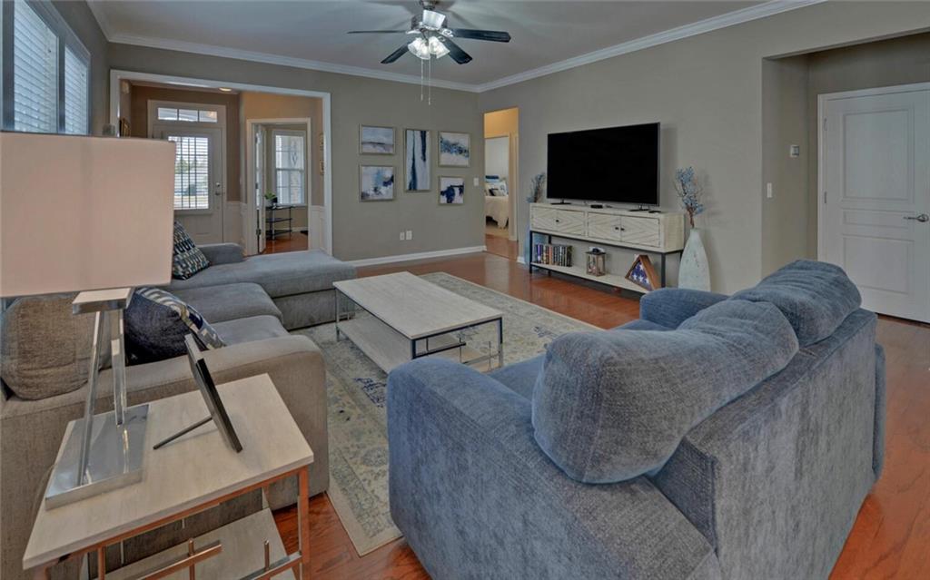 6213 Azalea Way Hoschton, GA 30548 - Photo 6 of 56 a living room with furniture and a flat screen tv