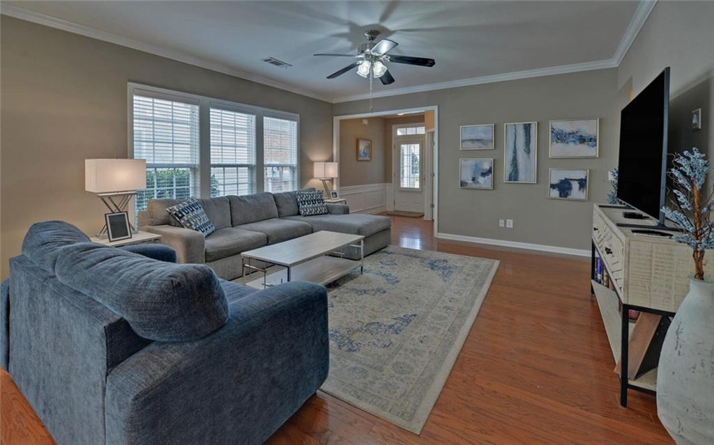 6213 Azalea Way Hoschton, GA 30548 - Photo 7 of 56 a living room with furniture and a flat screen tv