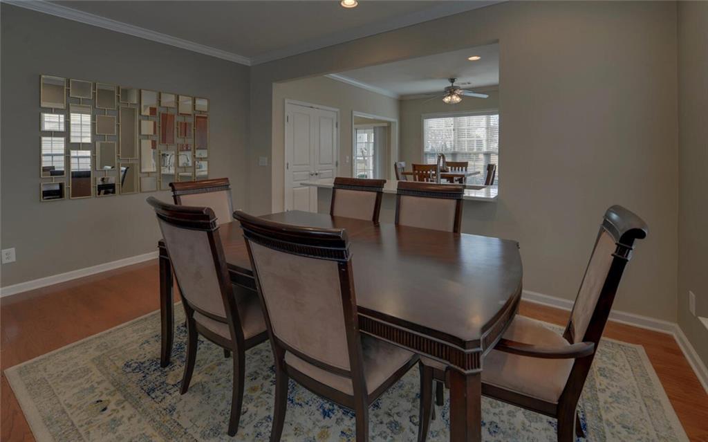 6213 Azalea Way Hoschton, GA 30548 - Photo 9 of 56 a view of a dining room with furniture and wooden floor