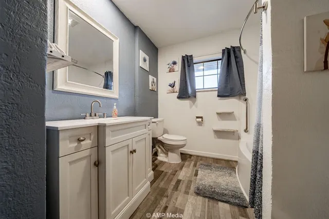 a bathroom with a bathtub and shower