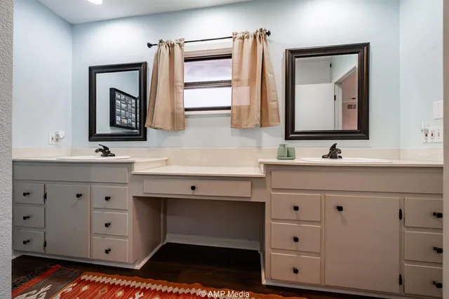 a living room with a bed furniture and a window