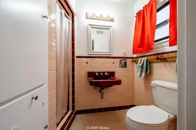 a utility room with cabinets washer and dryer