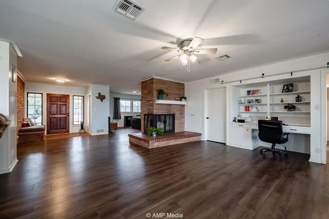 a living room with furniture rug and window