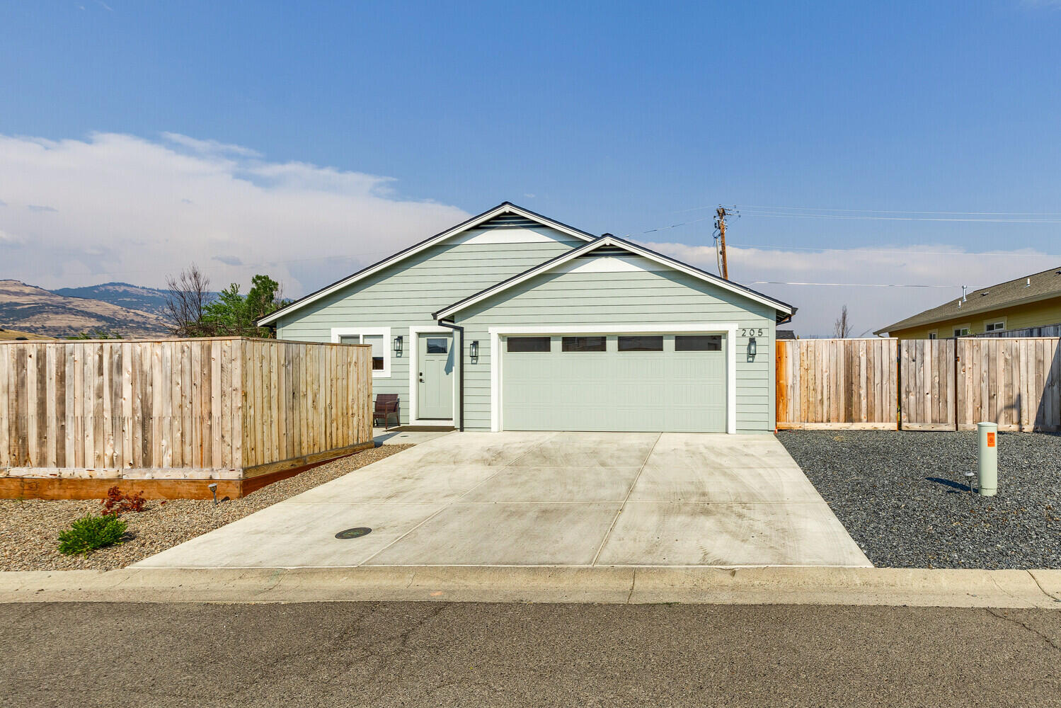 205 Suncrest Road Talent, OR 97540 - Photo 2 of 32 a front view of a house with a garage