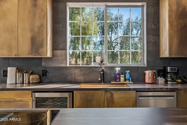 a view of a hallway and a livingroom with furniture