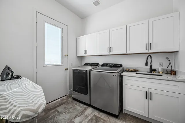 a bedroom with a bed and a chair