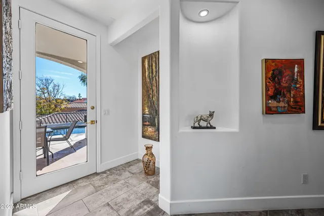 a bathroom with a granite countertop shower a sink and a mirror