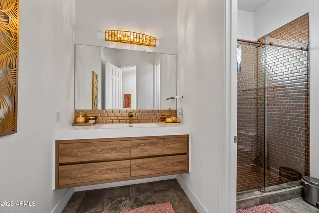 a spacious bedroom with a bed and cabinets