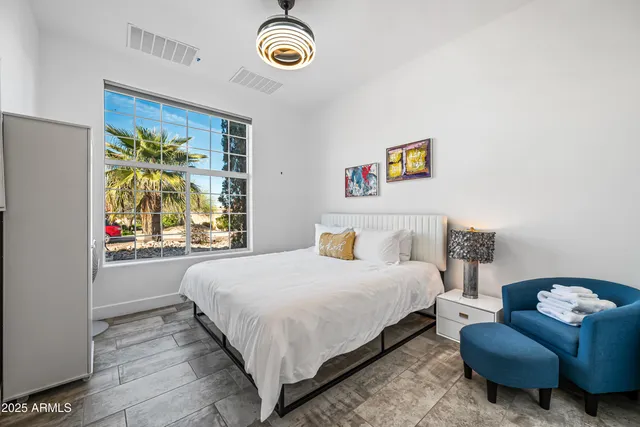 a view of a house with backyard and swimming pool