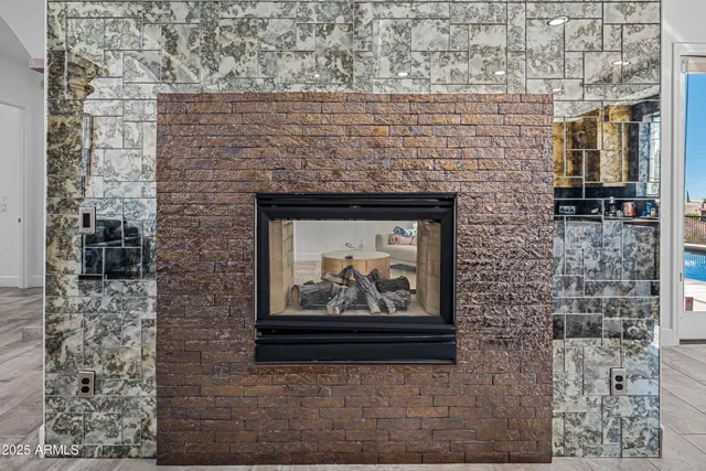 a view of a dining room and livingroom with furniture window and wooden floor