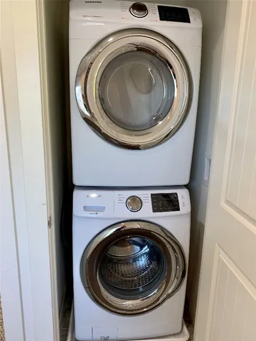 a room with a table and a chandelier