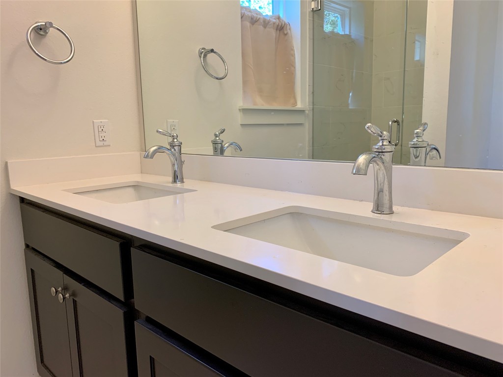 5205 Samuel Huston Avenue, Unit B Austin, TX 78721 - Photo 15 of 37 a close view of a sink and a mirror