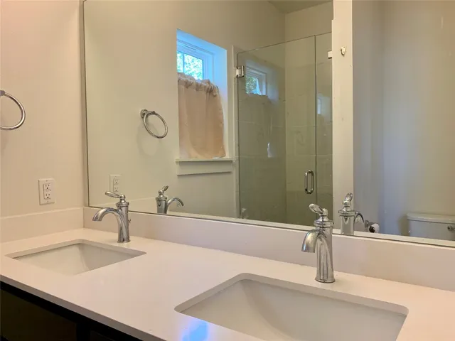 a close view of a sink and a mirror