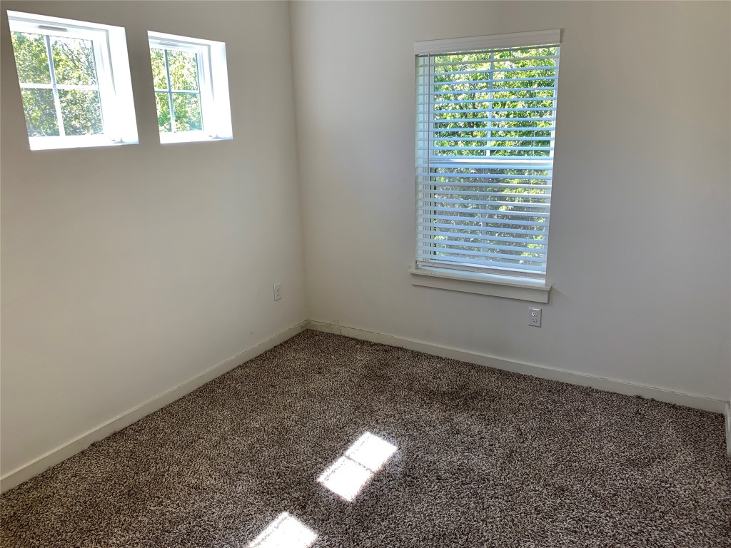 5205 Samuel Huston Avenue, Unit B Austin, TX 78721 - Photo 17 of 37 an empty room with a window