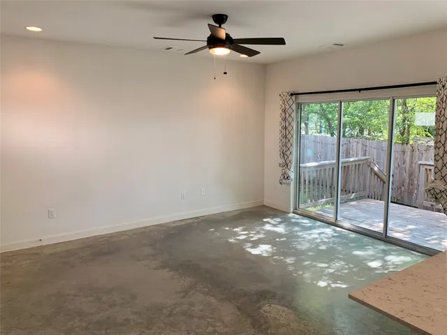 a bathroom with a granite countertop sink toilet and bathtub