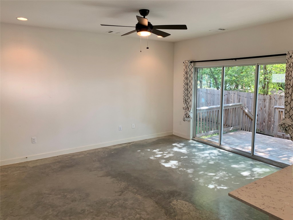 5205 Samuel Huston Avenue, Unit B Austin, TX 78721 - Photo 20 of 37 a view of an empty room with windows