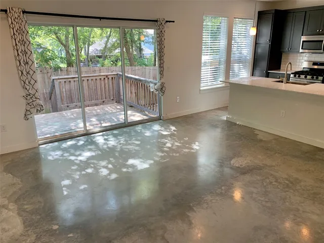 a view of an empty room with windows