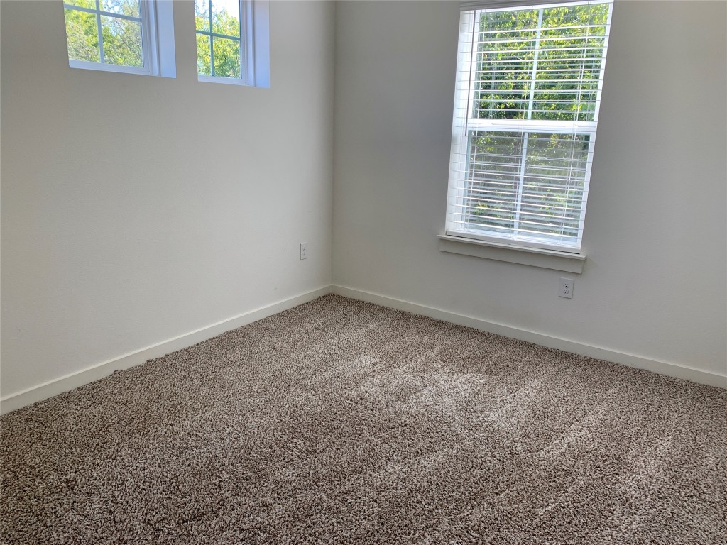 5205 Samuel Huston Avenue, Unit B Austin, TX 78721 - Photo 26 of 37 an empty room with a window
