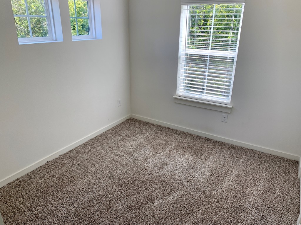 5205 Samuel Huston Avenue, Unit B Austin, TX 78721 - Photo 27 of 37 an empty room with a window