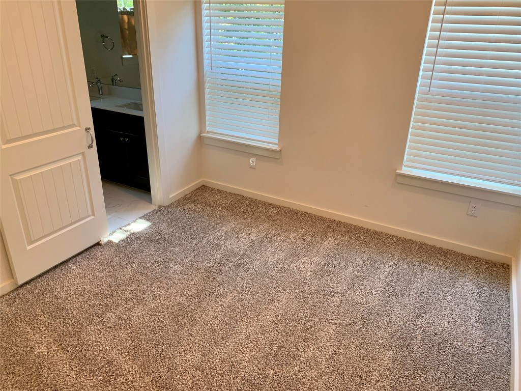 5205 Samuel Huston Avenue, Unit B Austin, TX 78721 - Photo 30 of 37 an empty room with windows