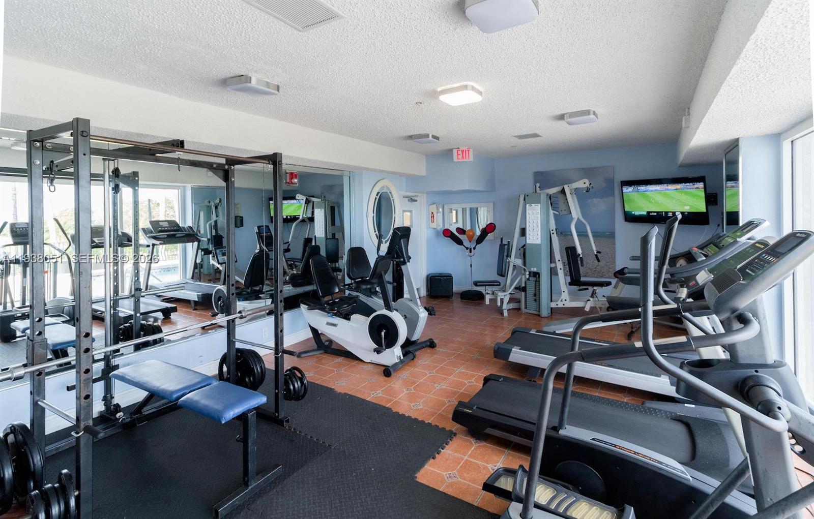 9195 Collins Avenue, Unit 611 Surfside, FL 33154 - Photo 19 of 33 a view of a room with gym equipment