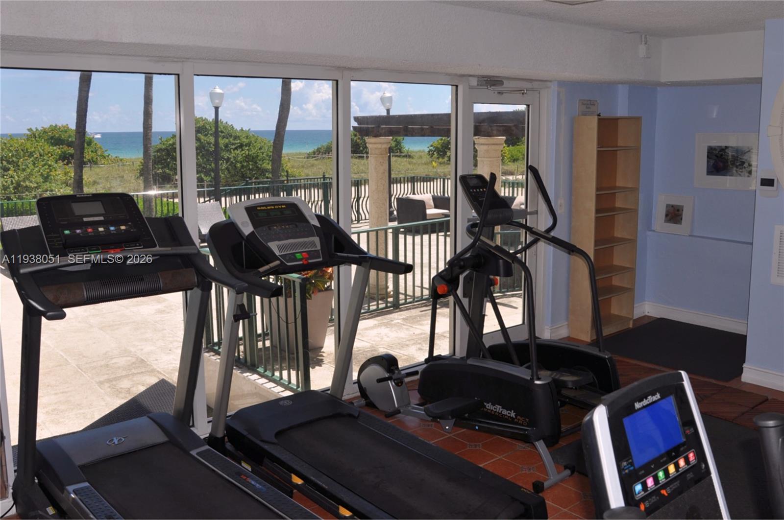 9195 Collins Avenue, Unit 611 Surfside, FL 33154 - Photo 25 of 33 a room with gym equipment and a large window