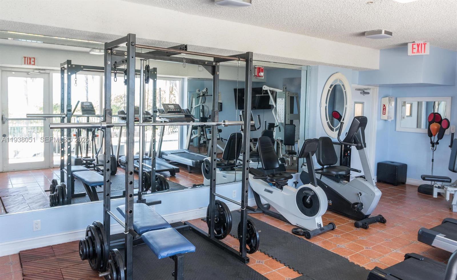 9195 Collins Avenue, Unit 611 Surfside, FL 33154 - Photo 31 of 33 a view of a room with gym equipment