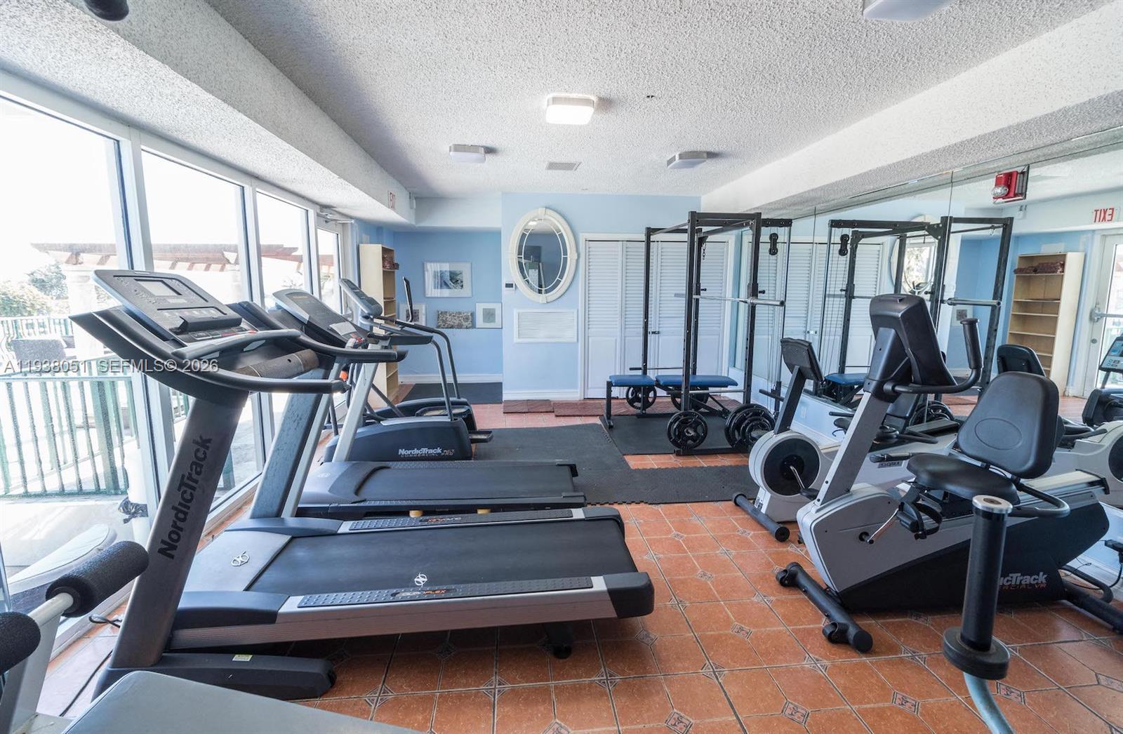 9195 Collins Avenue, Unit 611 Surfside, FL 33154 - Photo 32 of 33 a view of a room with gym equipment