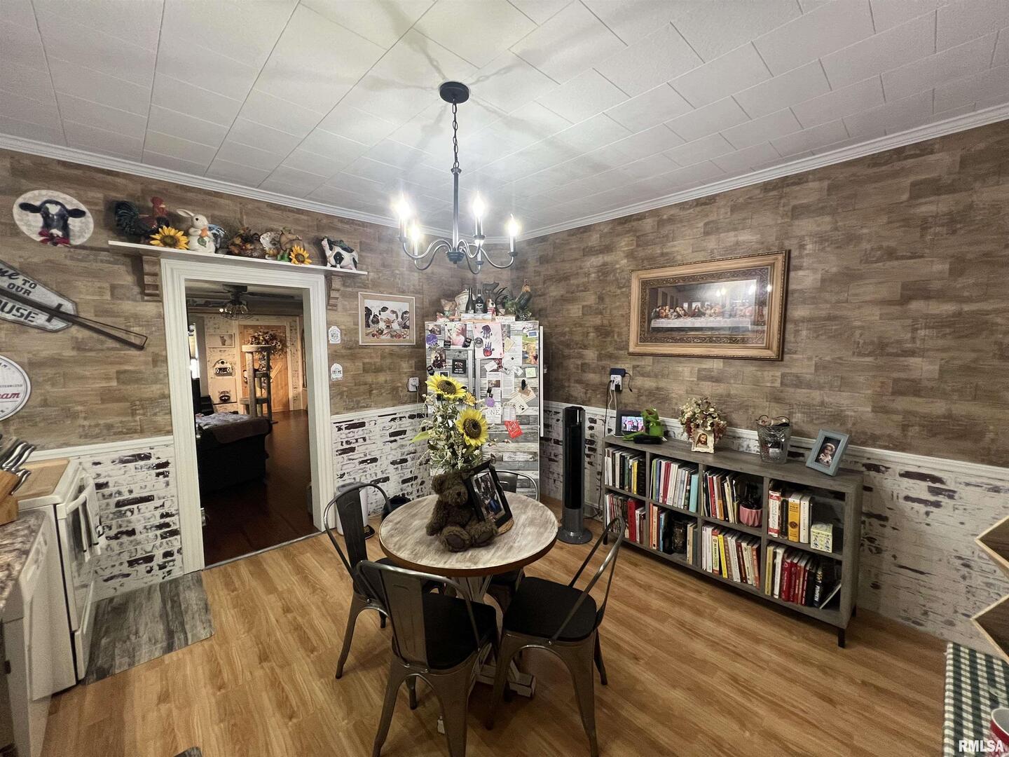 103 East Florence Street Sesser, IL 62884 - Photo 11 of 26 a view of a dining room with furniture and wooden floor