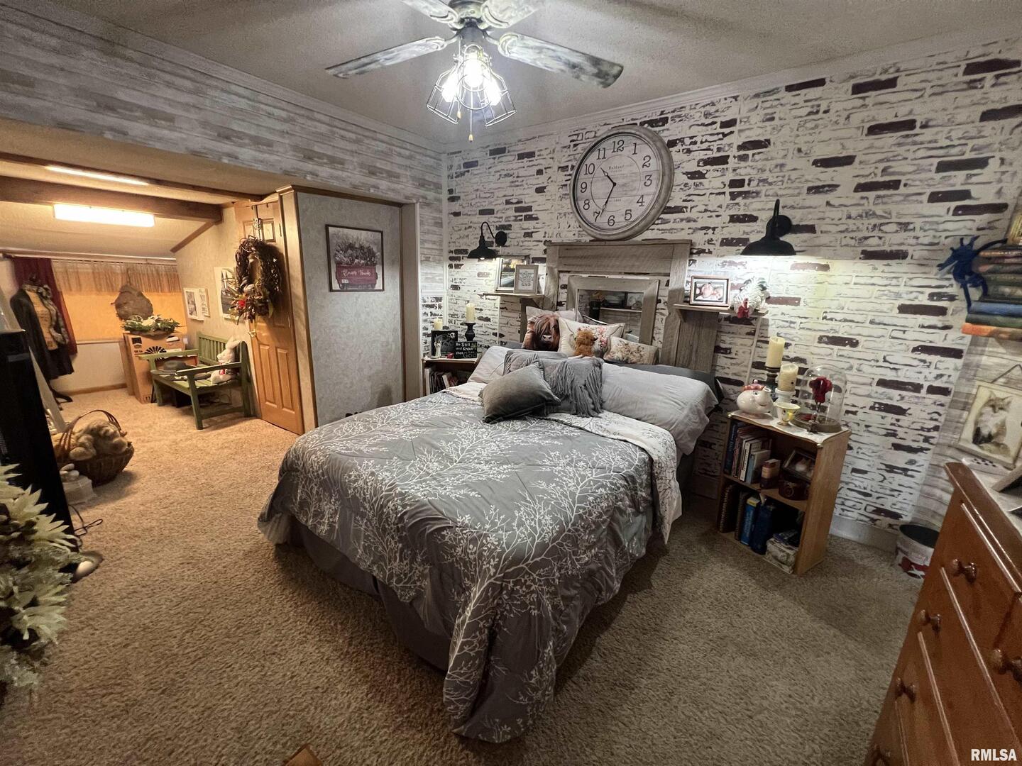 103 East Florence Street Sesser, IL 62884 - Photo 13 of 26 a bed room with a bed and a chandelier
