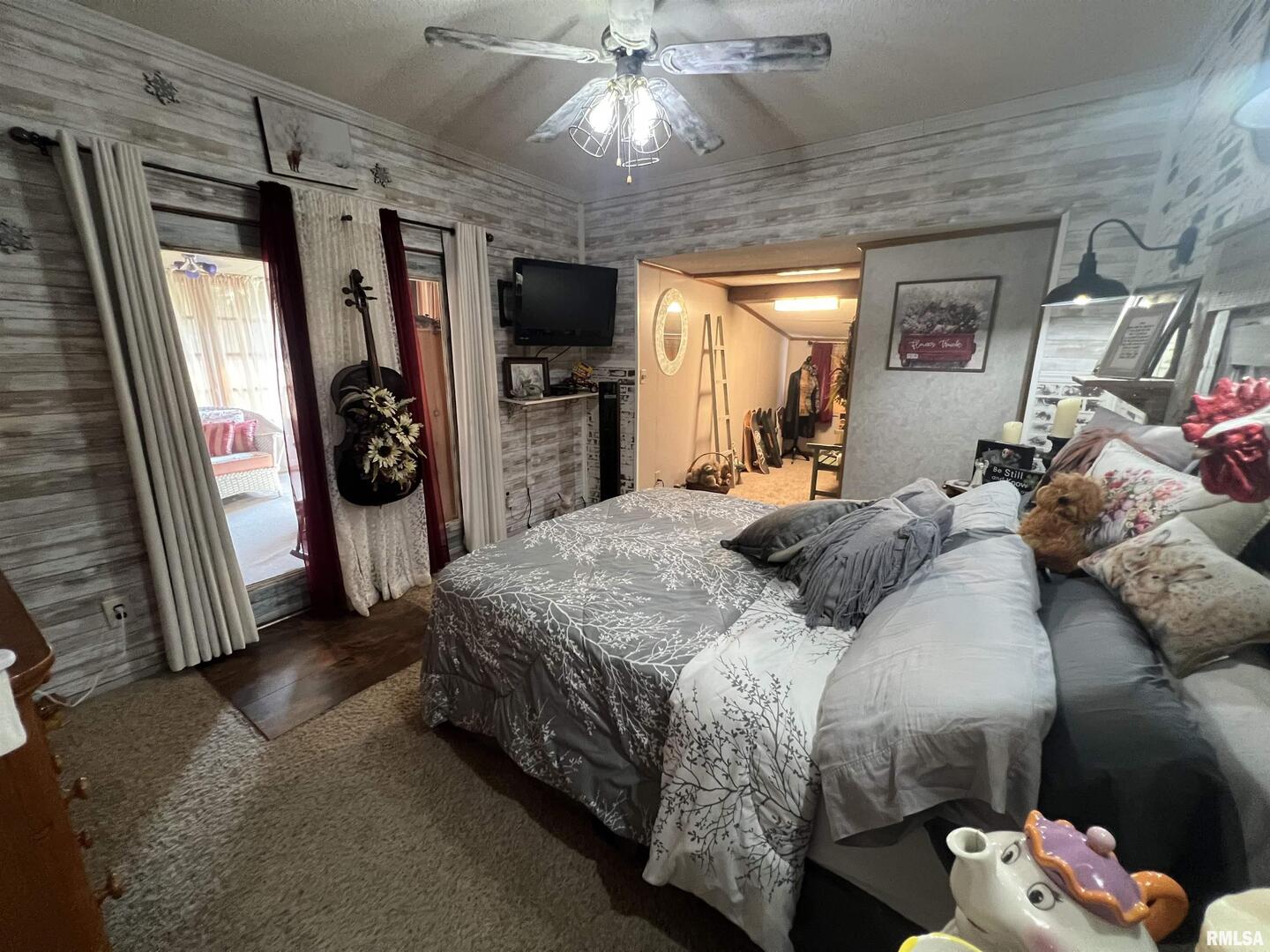 103 East Florence Street Sesser, IL 62884 - Photo 14 of 26 a bedroom with a bed and a chandelier