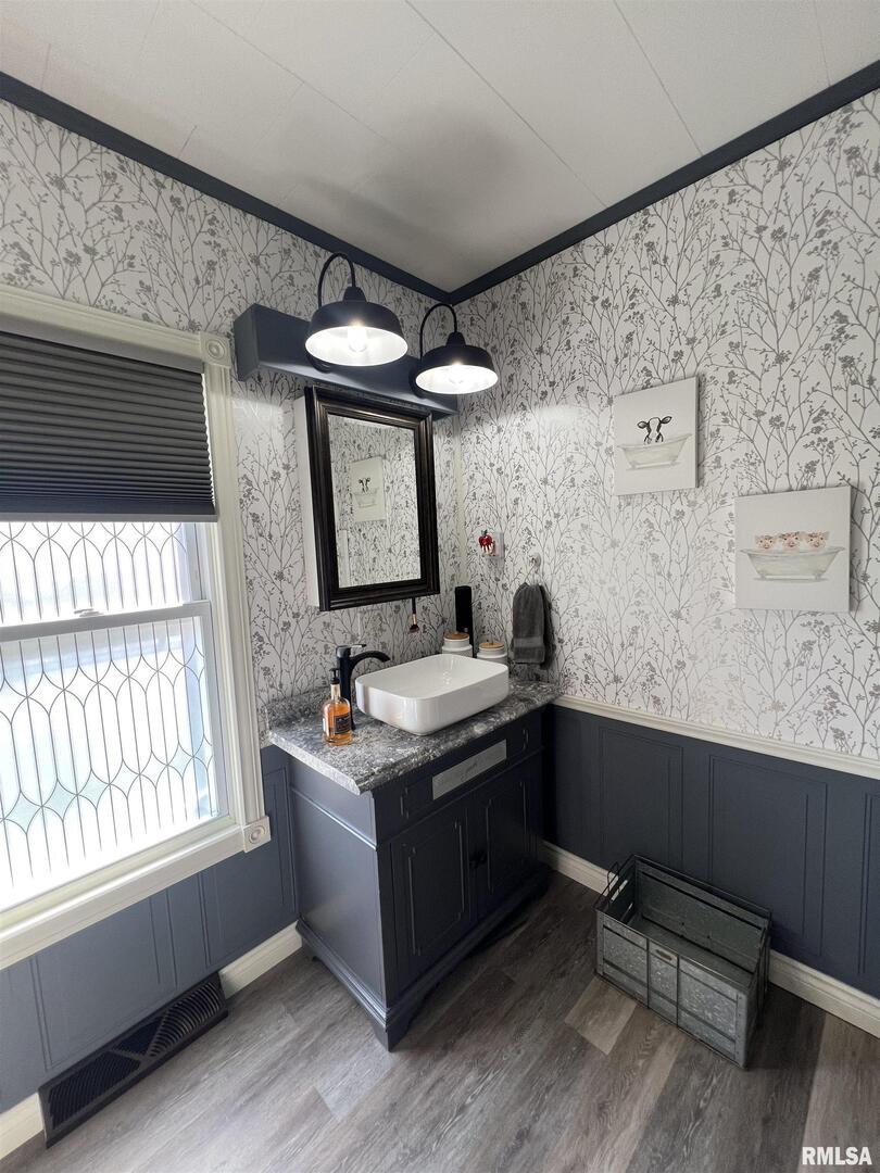 103 East Florence Street Sesser, IL 62884 - Photo 17 of 26 a bathroom with a sink vanity granite toilet and a mirror