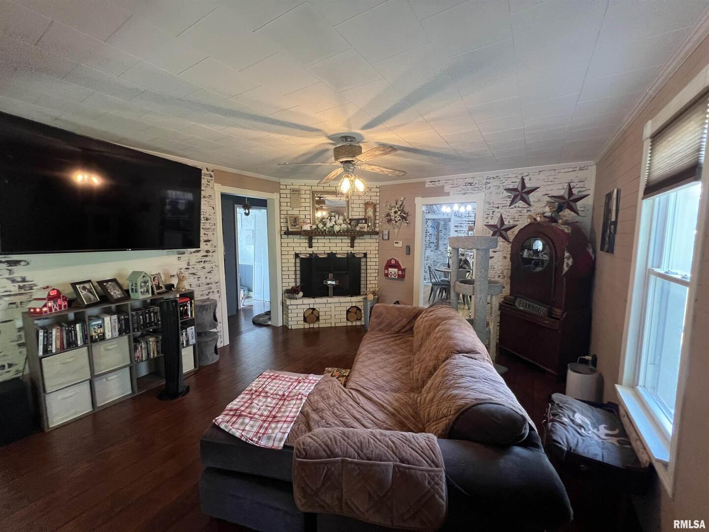 103 East Florence Street Sesser, IL 62884 - Photo 3 of 26 a living room with furniture and a flat screen tv