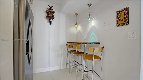 a bathroom with a mirror and a shower