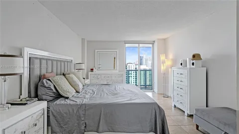 a bed room with furniture and a wooden floor