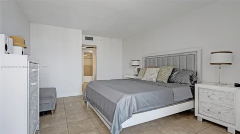 a bedroom with a bed and a cabinets