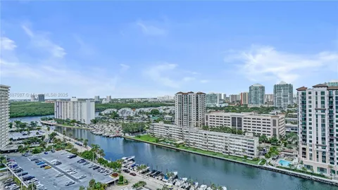 a view of a city with a lake