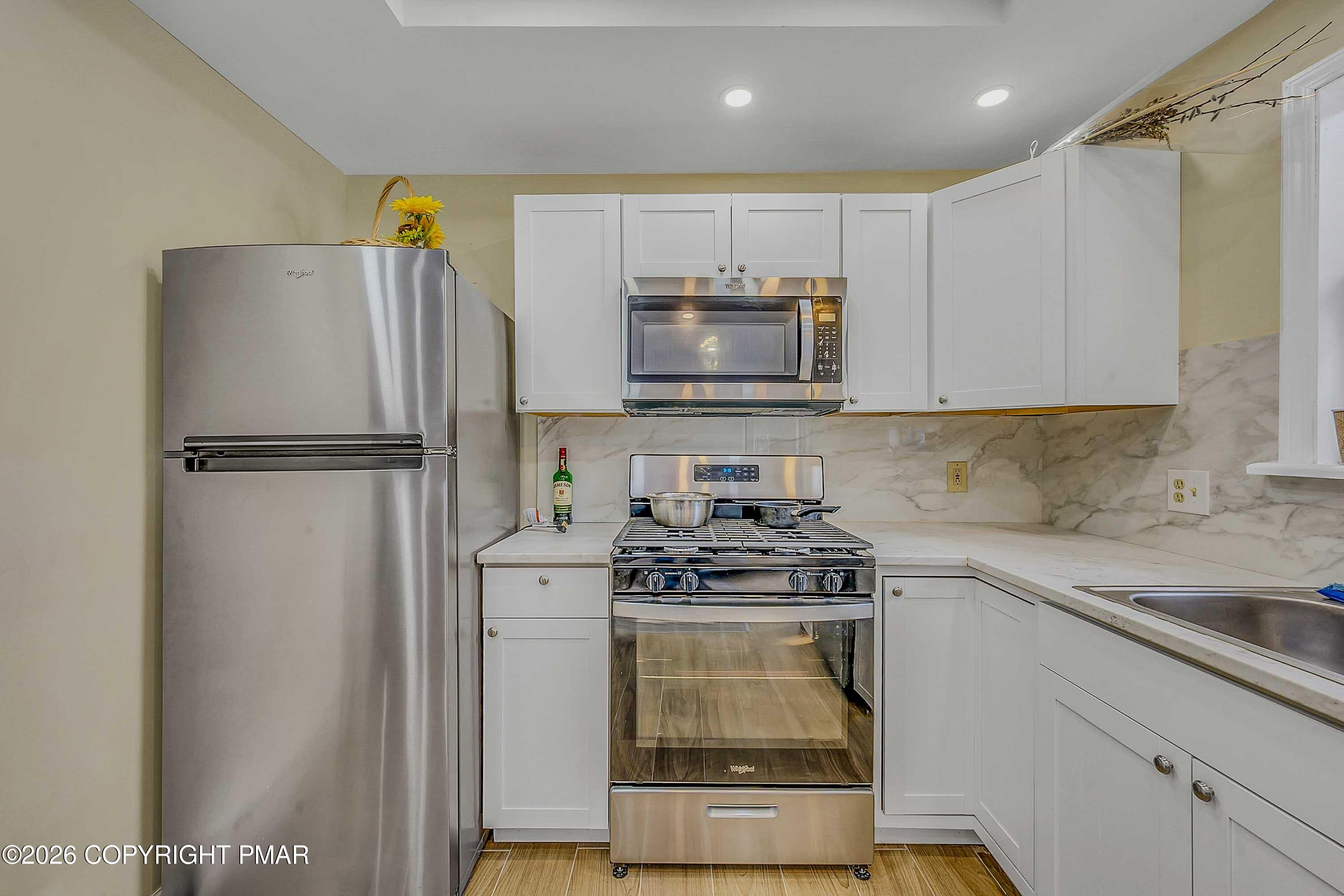 1027 Valley Road Newfoundland, PA 18445 - Photo 12 of 31 a kitchen with a stove a refrigerator and a sink