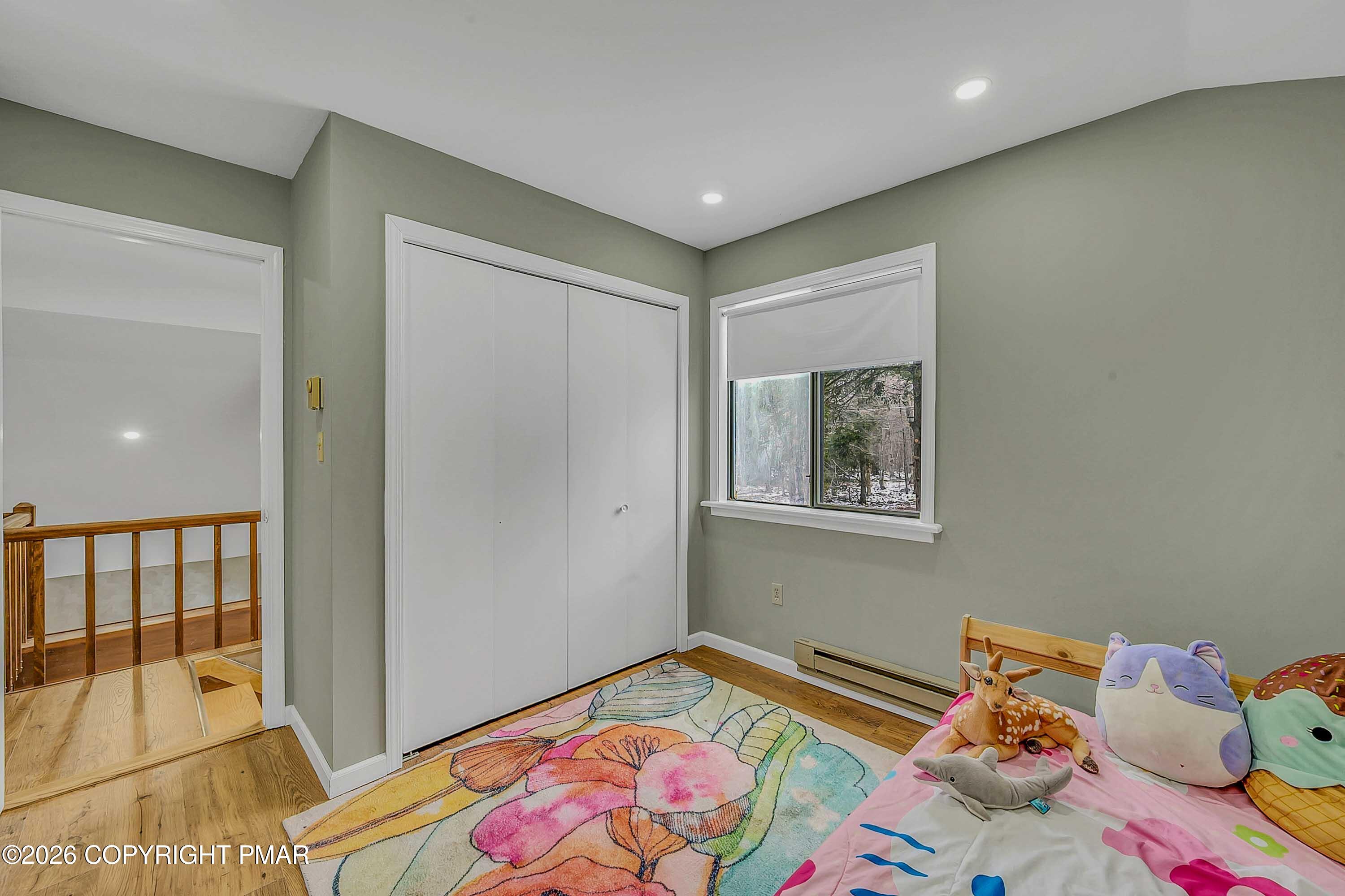 1027 Valley Road Newfoundland, PA 18445 - Photo 19 of 31 a bedroom with a bed and a window